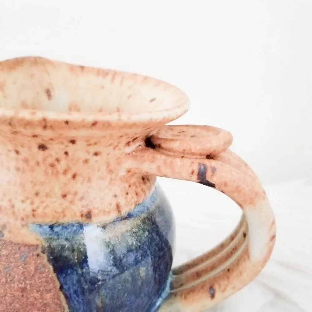 Pottery creamer signed by artist